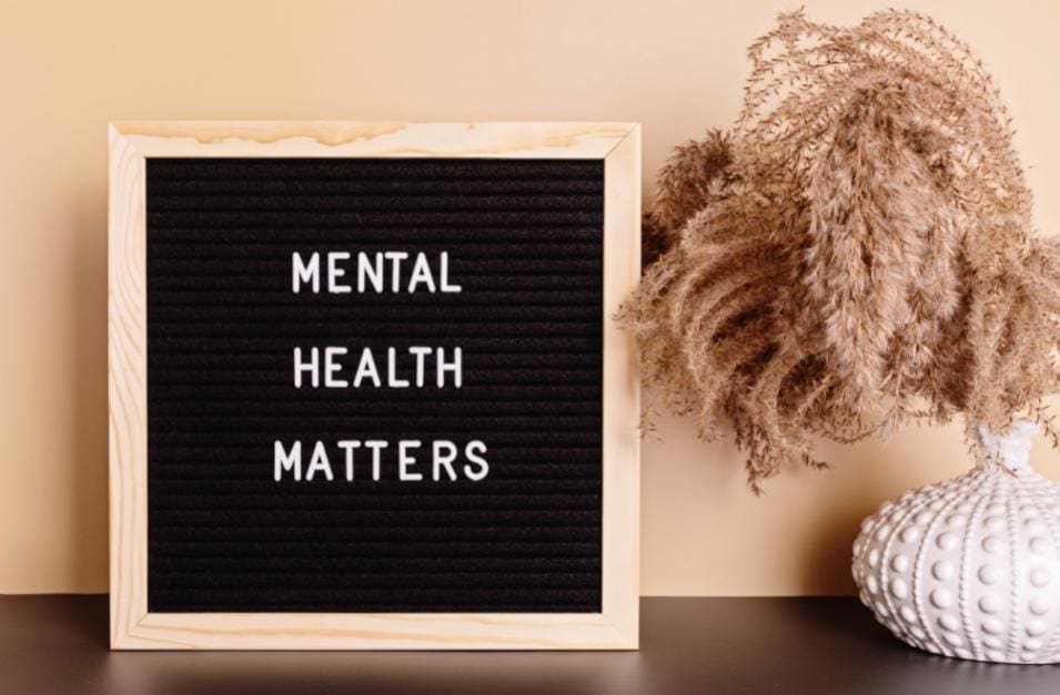 A blackboard highlighting the importance of mental health alongside an entrepreneurial motif.