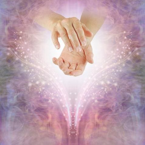 A woman's hand reaching out in front of a vibrant purple background, symbolizing being open to receive abundance through EFT tapping.
